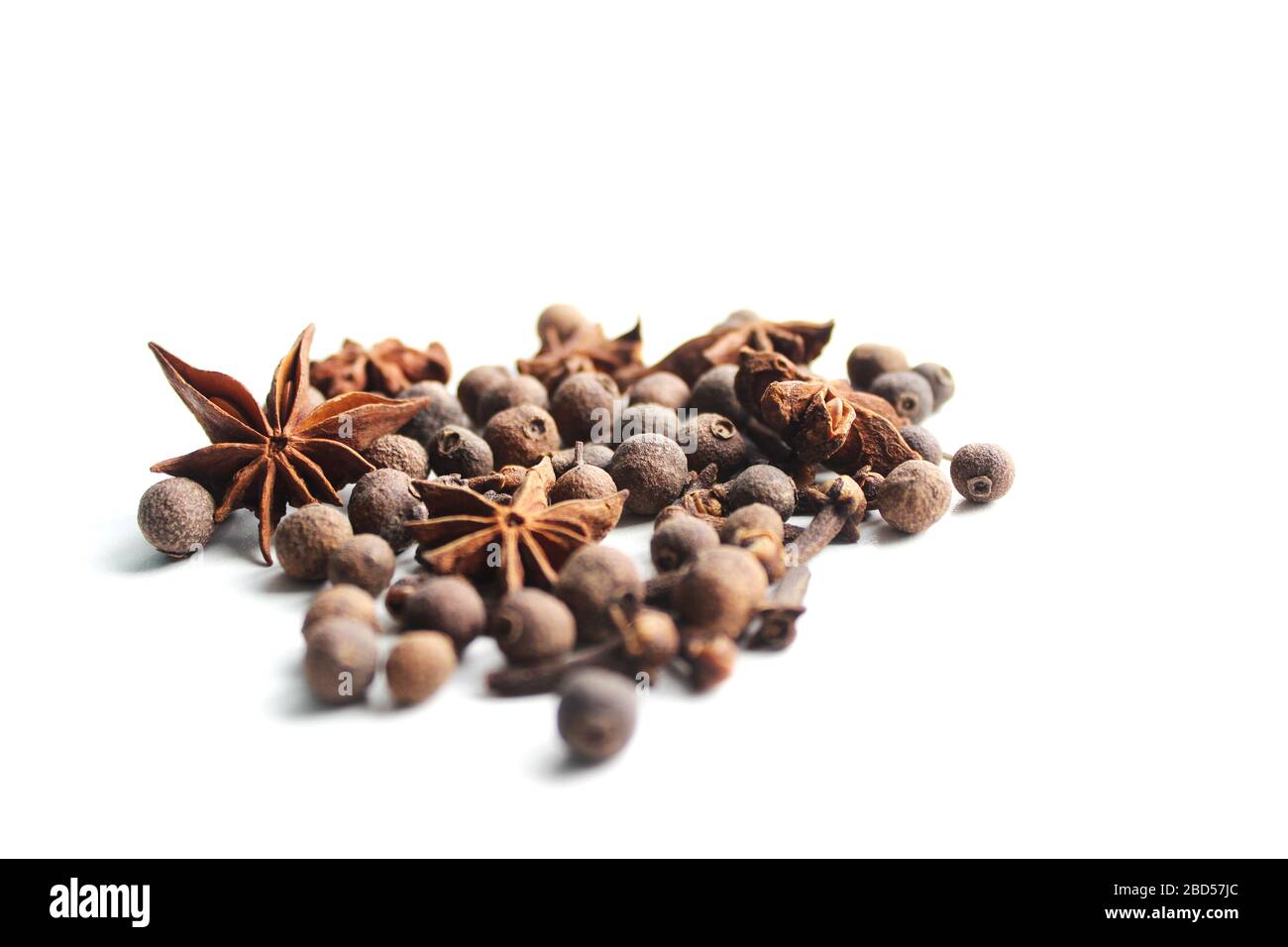 On white background - anise, black pepper, allspice. Healthy eating concept. Background to insert text or spice catalog. Diet Stock Photo