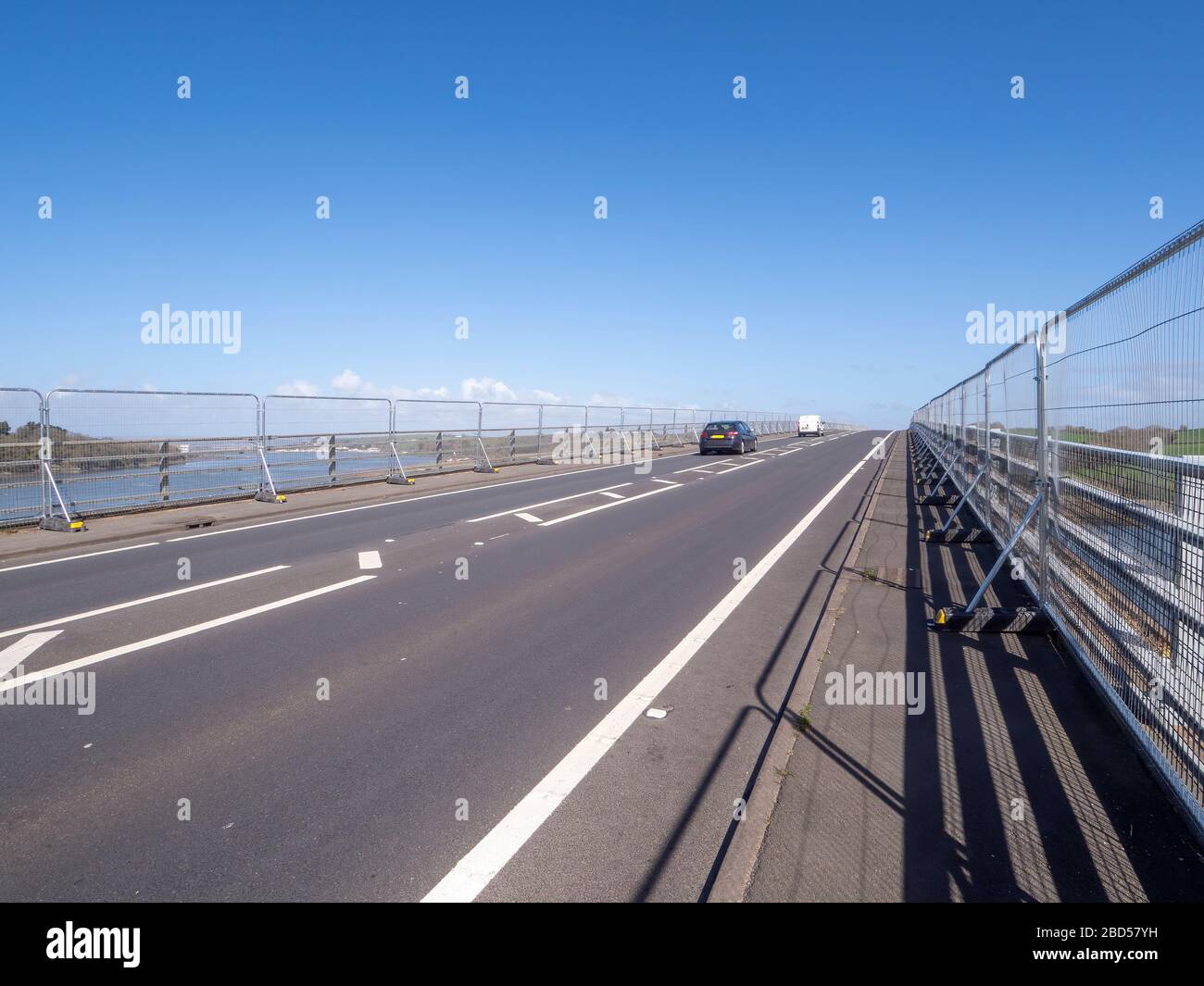 Anti suicide barriers attached to the bridge over the River Torridge at Bideford, north Devon, Fixed April 2020. Unidentifiable cars. Stock Photo