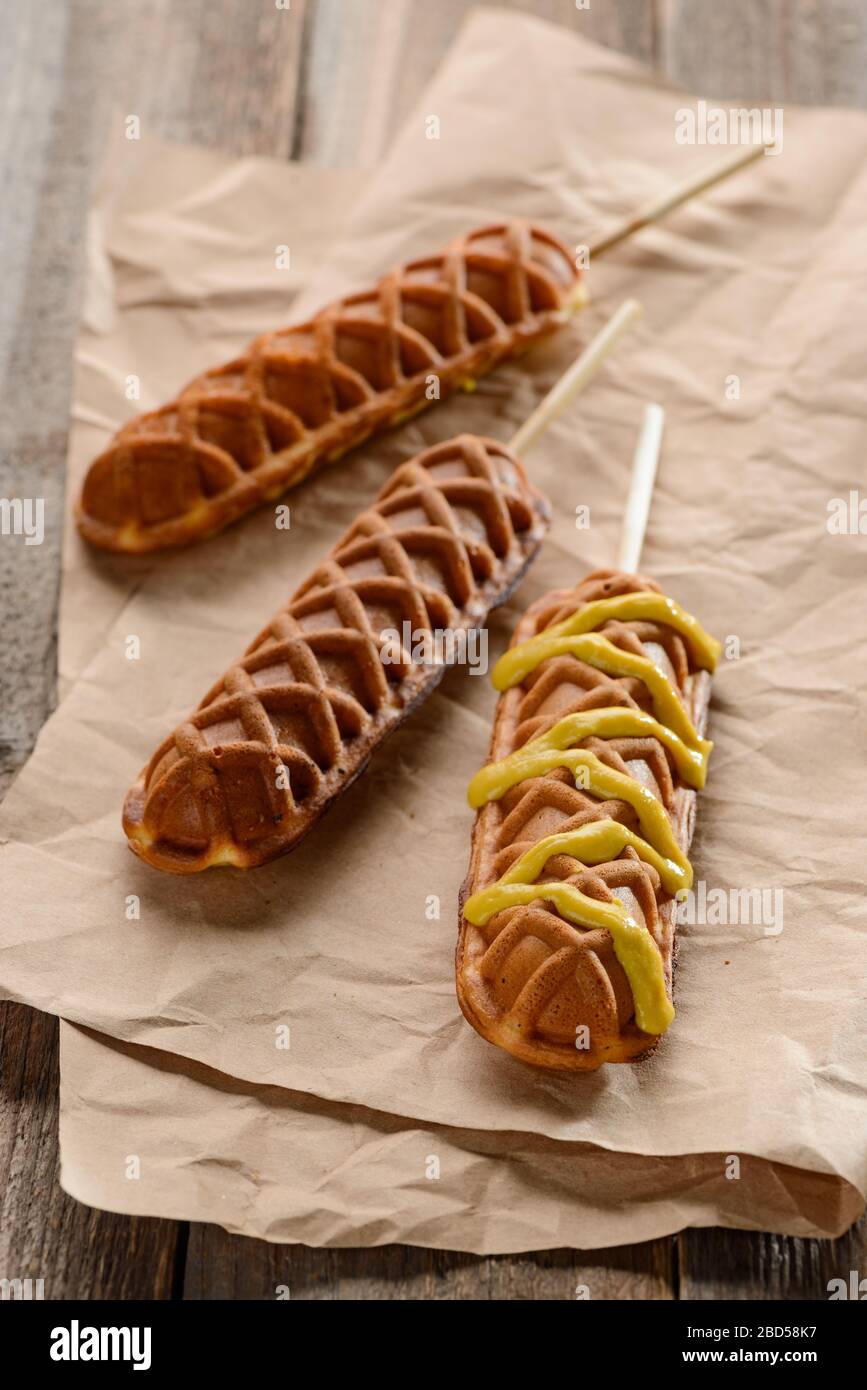 Close Up On Tasty Waffle Corn Dogs With Mustard Stock Photo Alamy