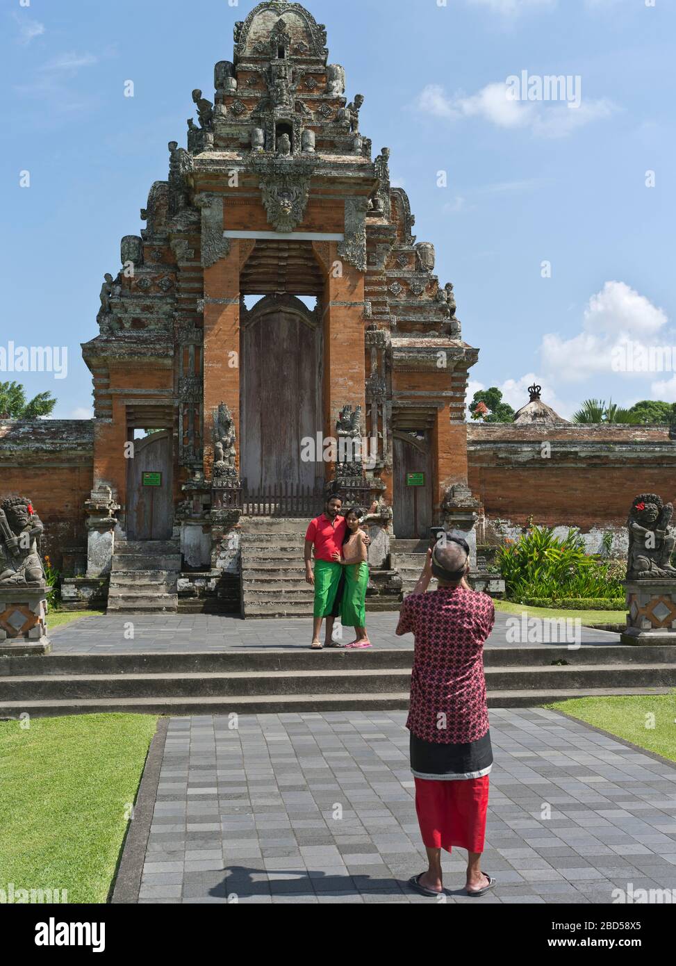 dh Pura Taman Ayun Royal Temple BALI INDONESIA Tourists being photo Balinese Hindu Mengwi temples Paduraksa hinduism gate architecture tourist Stock Photo