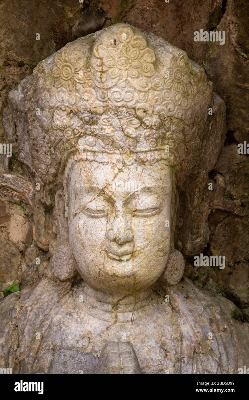 Buddha  rock-cut sculpture, Felai Feng grottoes, Lingyin Temple, West Lake, Hangzhou, Chins Stock Photo