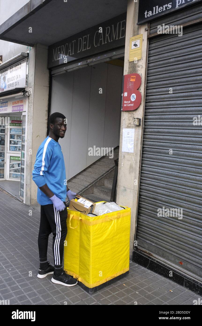 young Amazon delivery man at mercat del Carmel Barcelona,Spain Stock