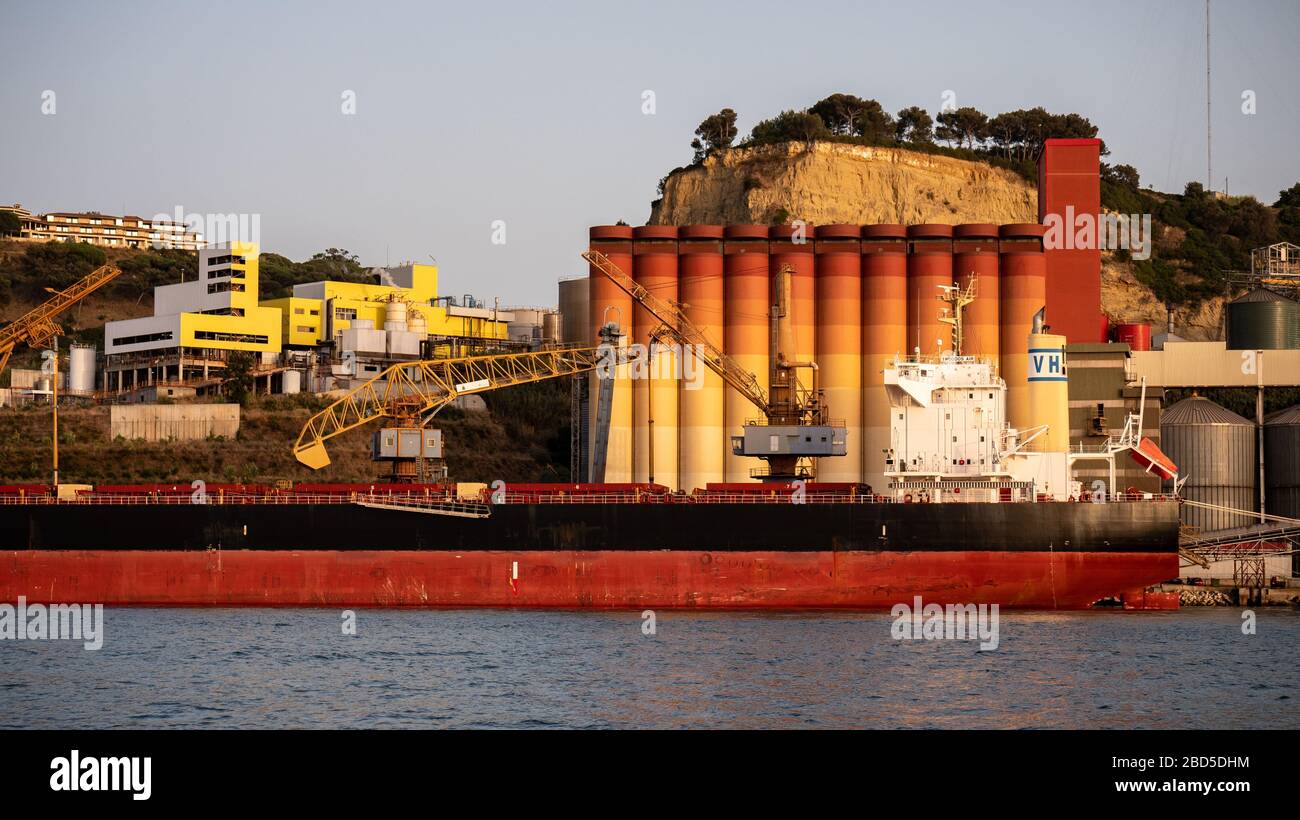 A tanker in port on the River Tagus near Porto Brandao, Lisbon, with ...