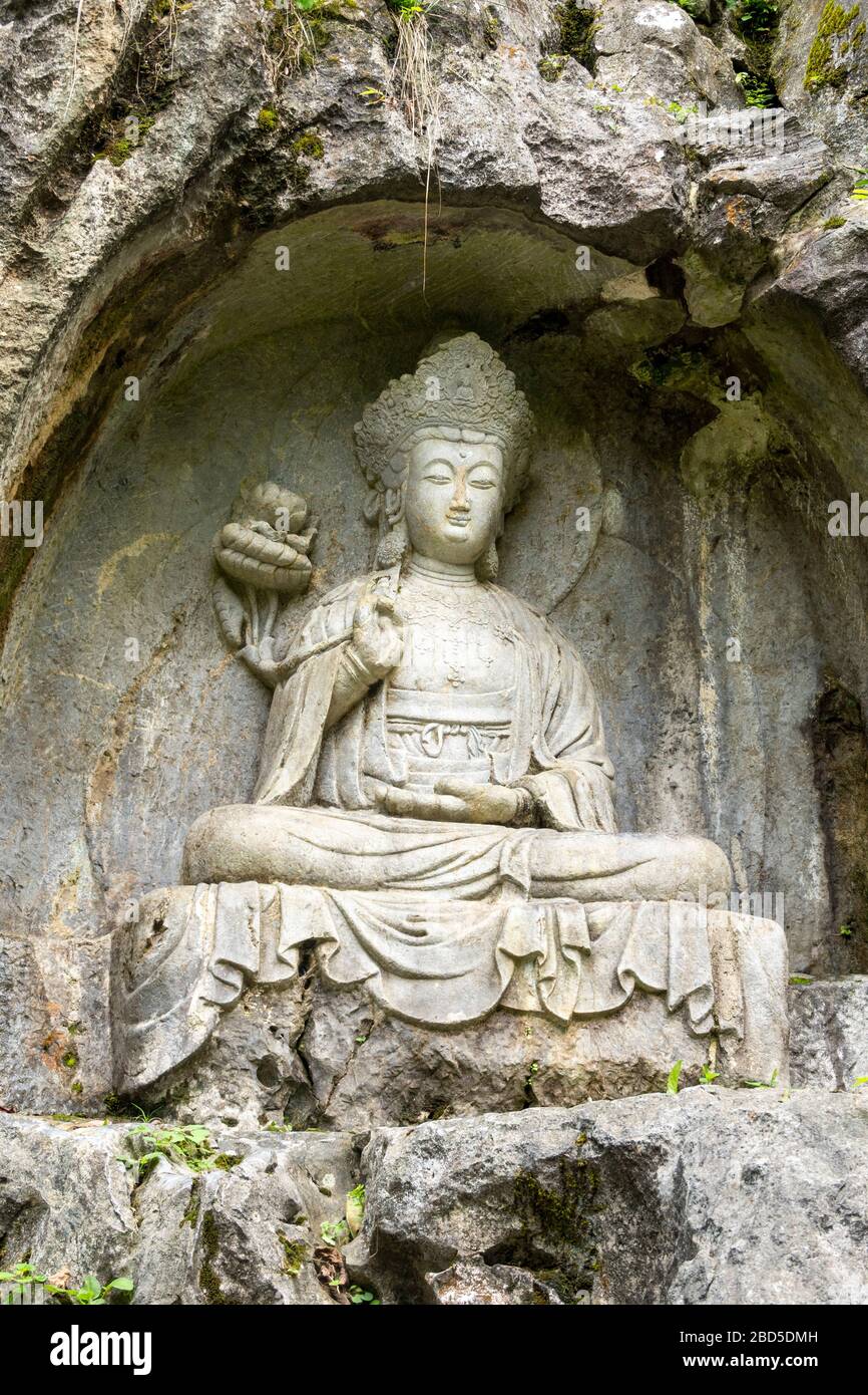 Buddha  rock-cut sculpture, Felai Feng grottoes, Lingyin Temple, West Lake, Hangzhou, China Stock Photo