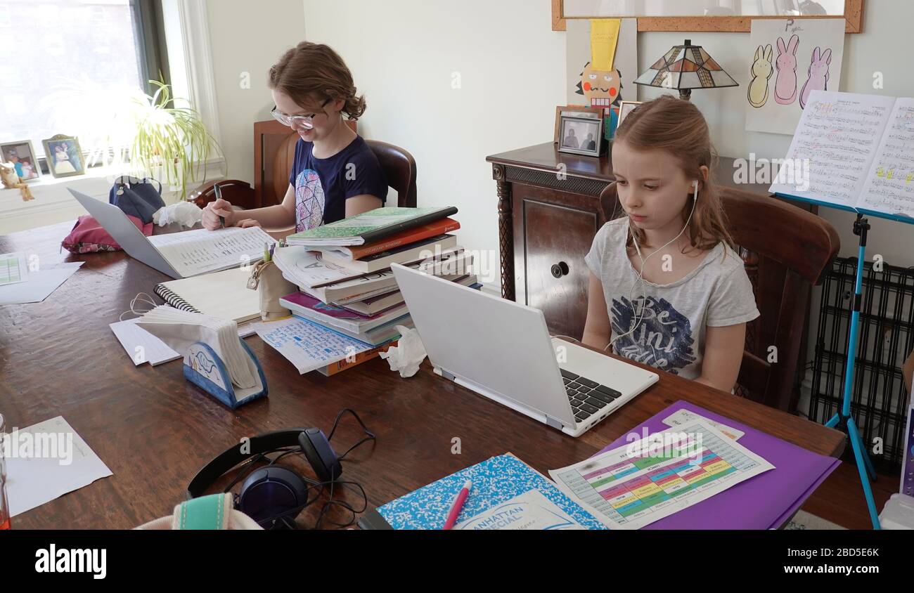 New York, USA. 2020. School children working from home during the Coronavirus lockdown, Stock Photo