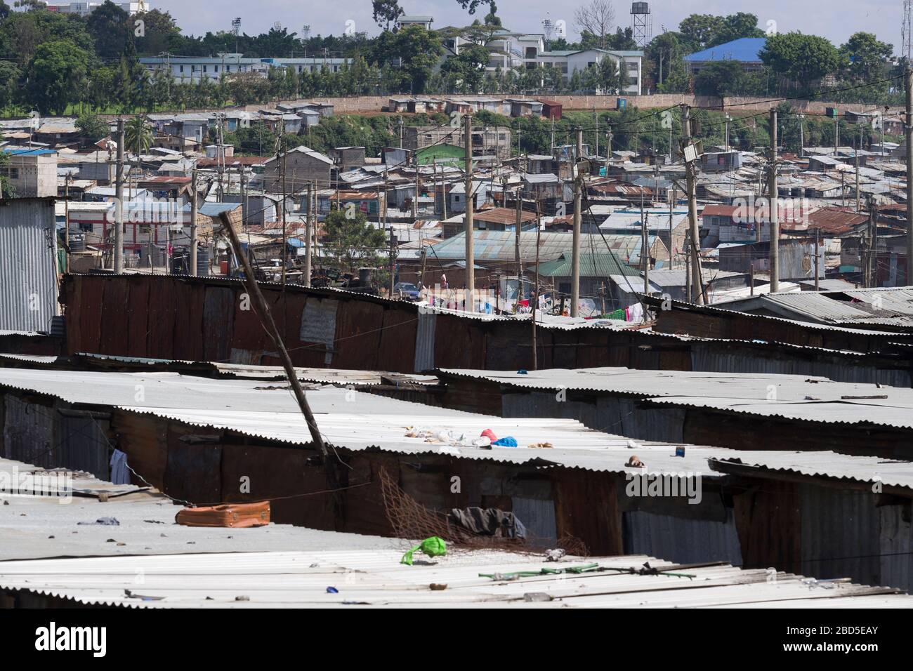A view across corrugated iron rooftops of Mathare, Nairobi, Kenya.  Mathare is a collection of slums in North East of central Nairobi, Kenya with a po Stock Photo