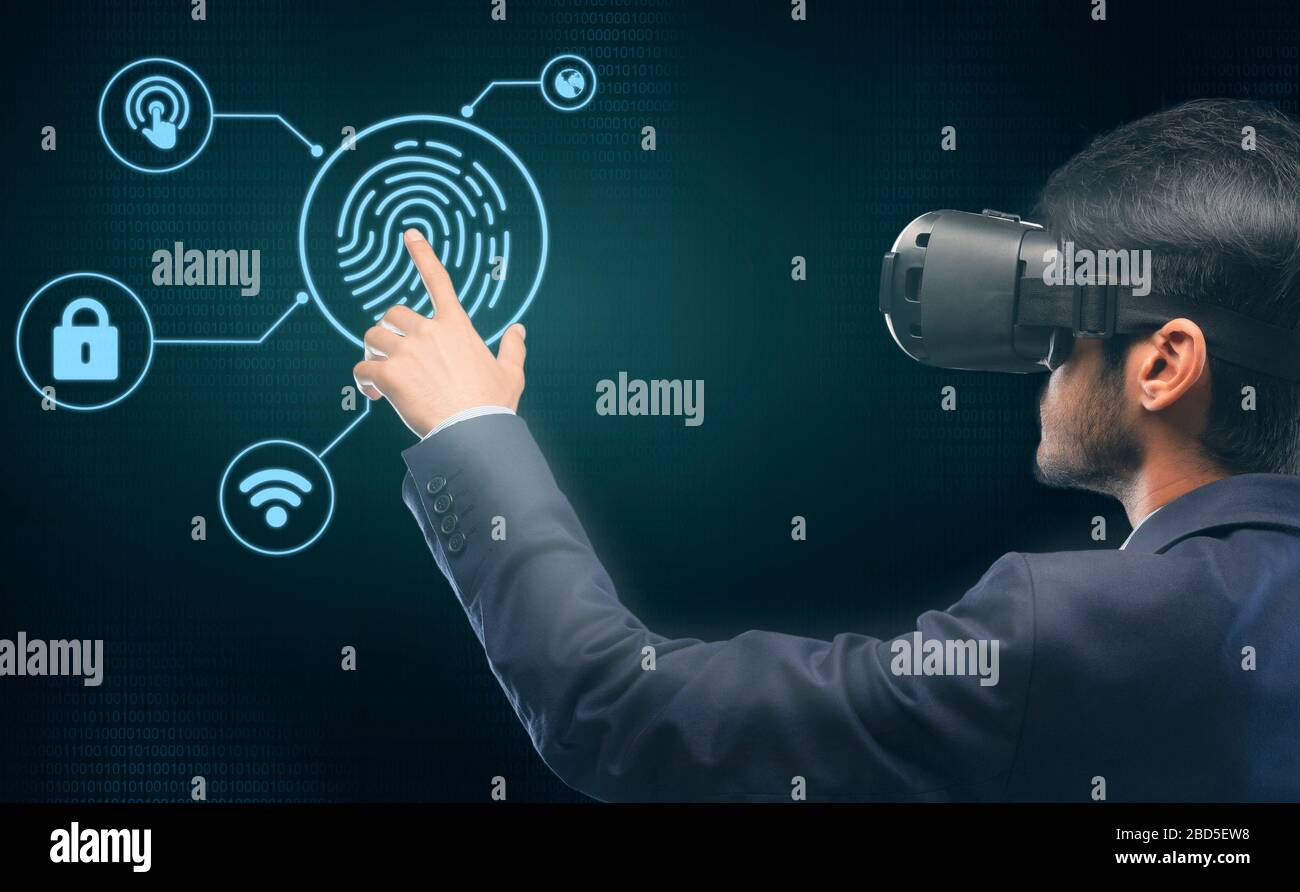 Businessman In VR Headset Touching Virtual Panel For Verification Stock Photo