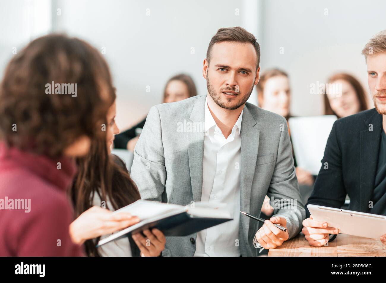 close up. brooding entrepreneur sitting at office Desk Stock Photo