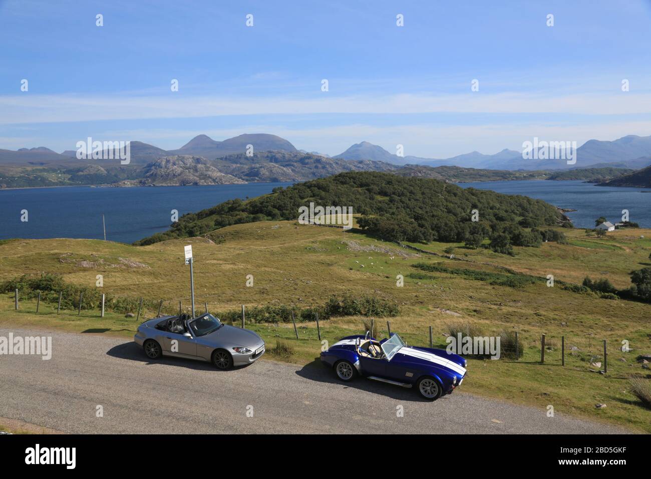 Two sports cars parked on the North coast 500 route, Scotland, UK. Stock Photo