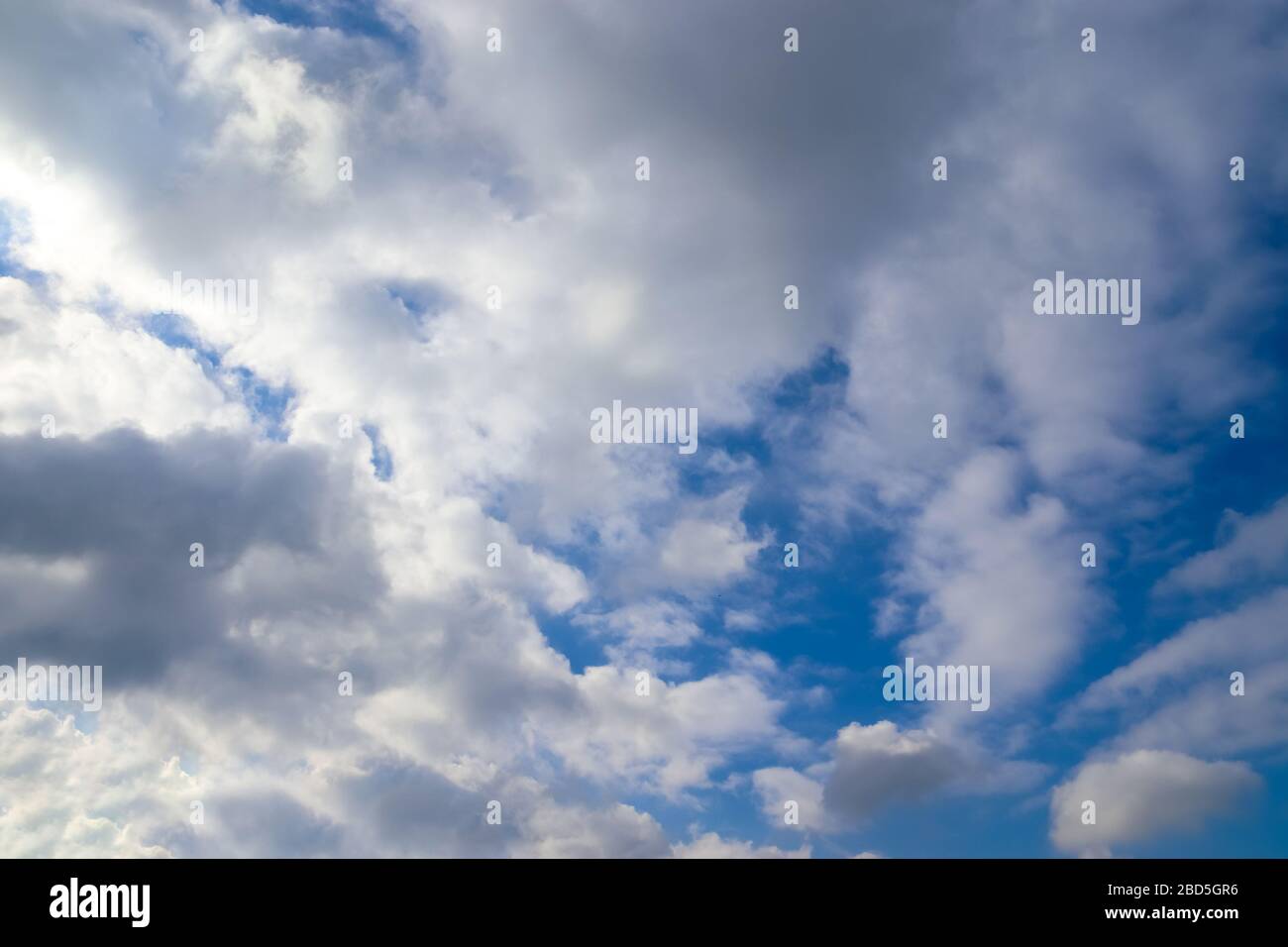 Beautiful white fluffy clouds in a deep blue summer sky Stock Photo - Alamy