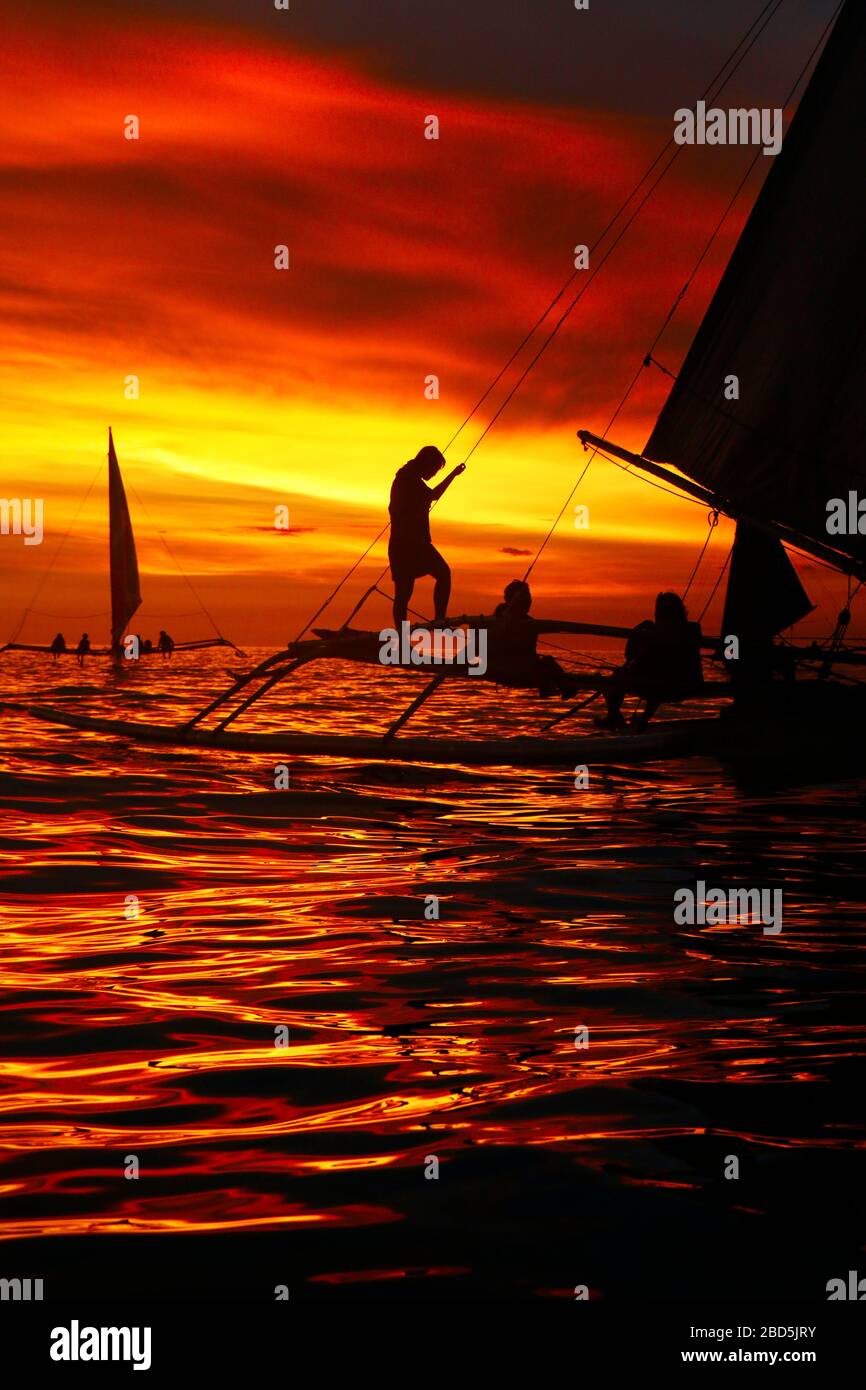 silhouette of boat on the beach during sunset in philippines Stock ...