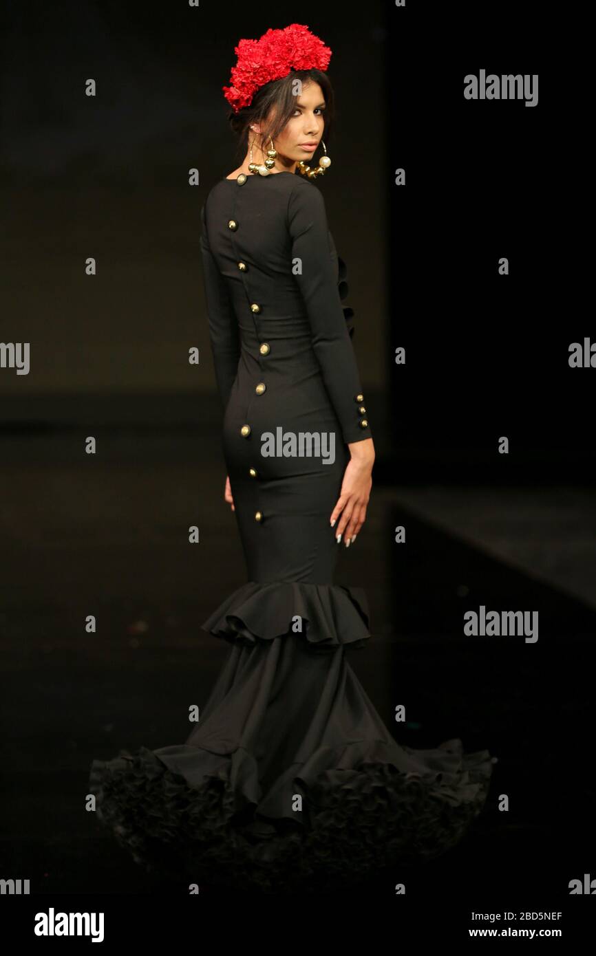 SEVILLA, SPAIN - JAN 30: Model Juana wearing a dress from the Alma collection by designer Jorge Sanche as part of the SIMOF 2020 (Photo credit: Mickael Chavet) Stock Photo