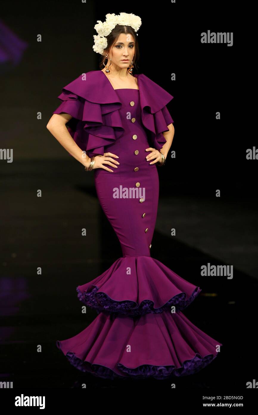 SEVILLA, SPAIN - JAN 30: Model wearing a dress from the Alma collection by designer Jorge Sanchez as part of the SIMOF 2020 (Photo credit: Mickael Chavet) Stock Photo