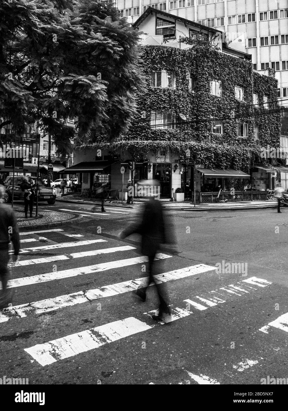 A man crossing Black and White Stock Photos & Images - Alamy