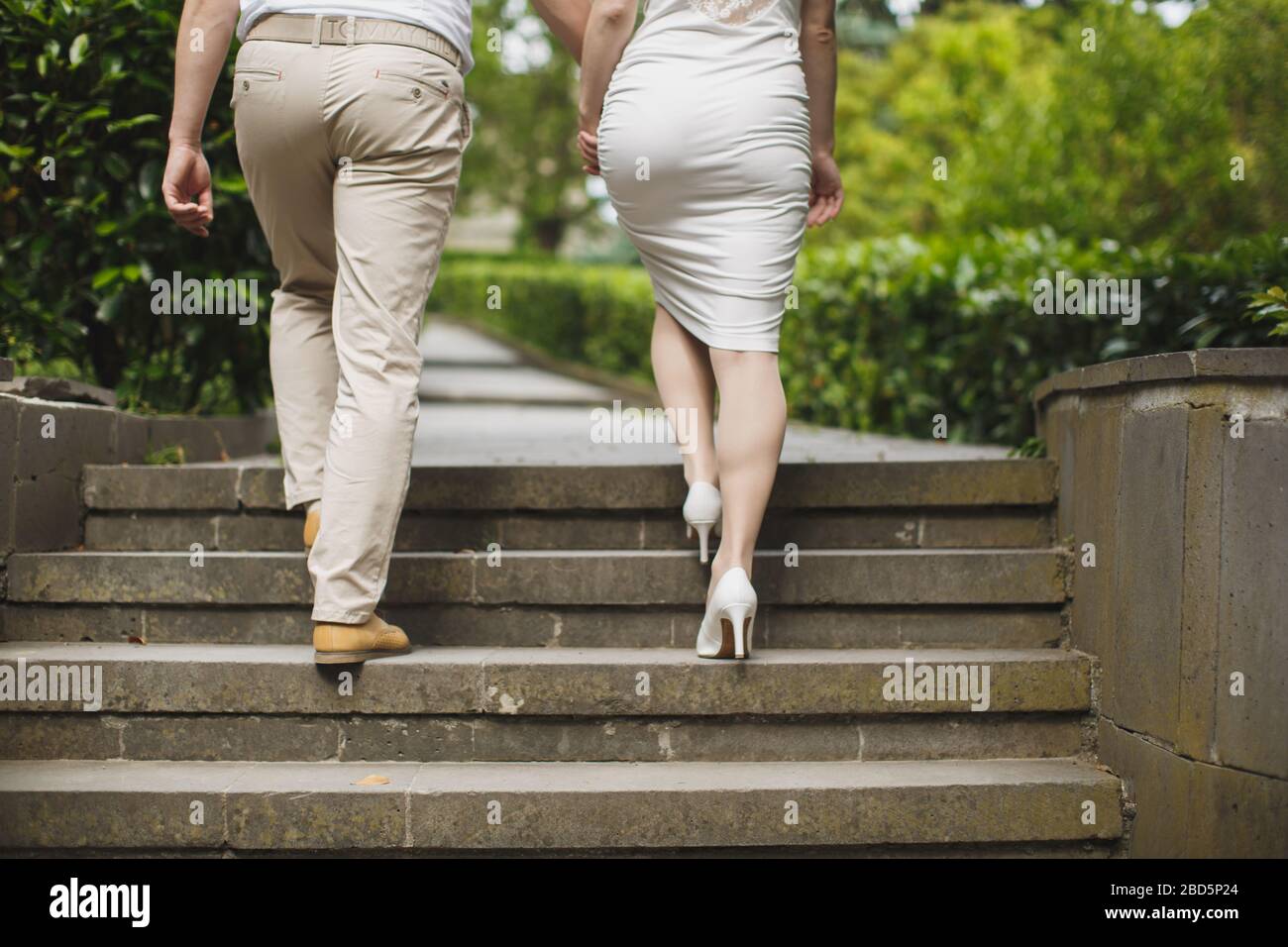 Young Couple Boy And Girl Hold Hands And Go Up The Stairs Stock Photo Alamy Young Couple Boy And Girl Hold Hands And Go Up The Stairs Stock Photo Alamy