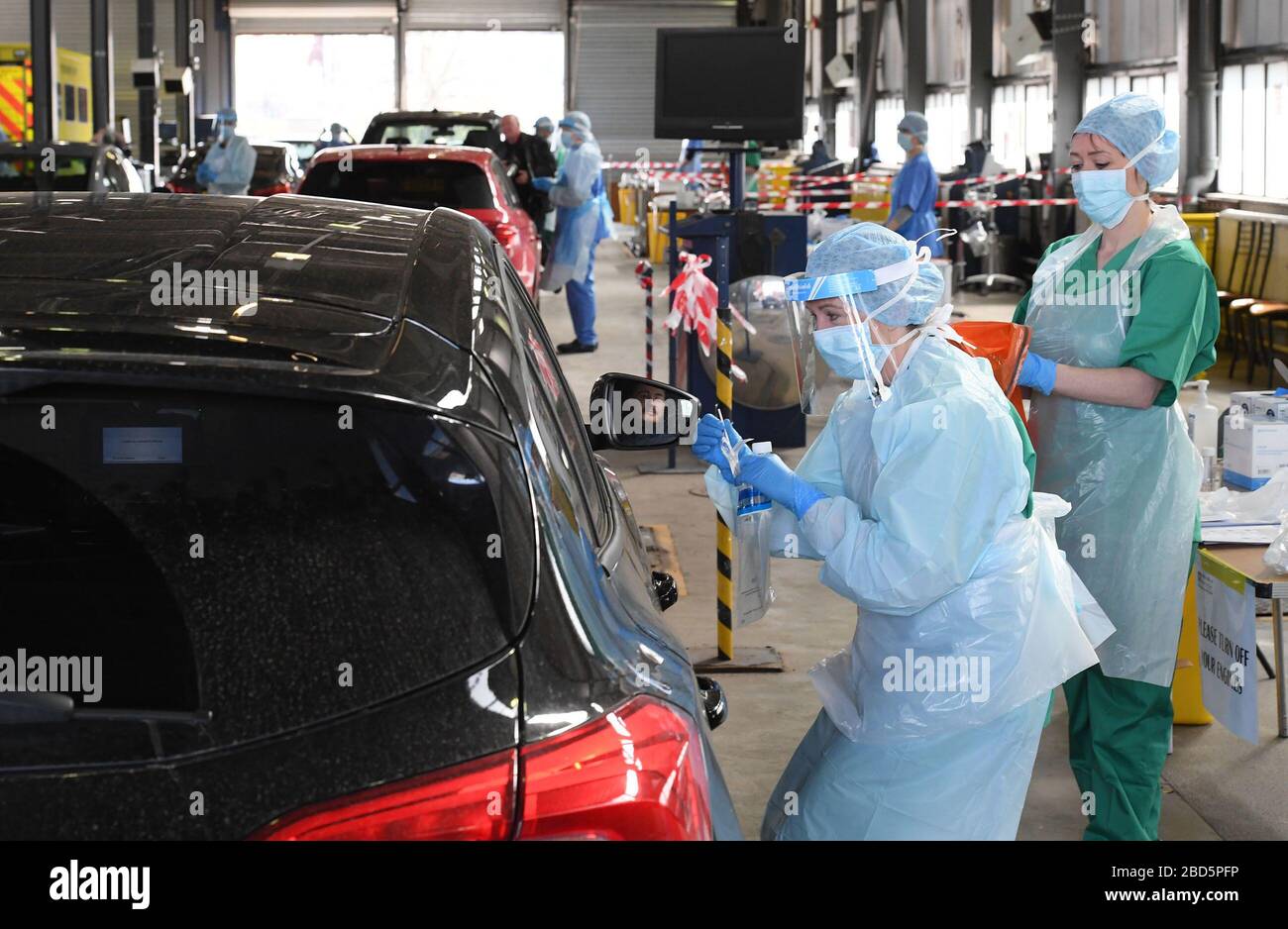 Medical staff take samples at an MOT testing centre in Belfast