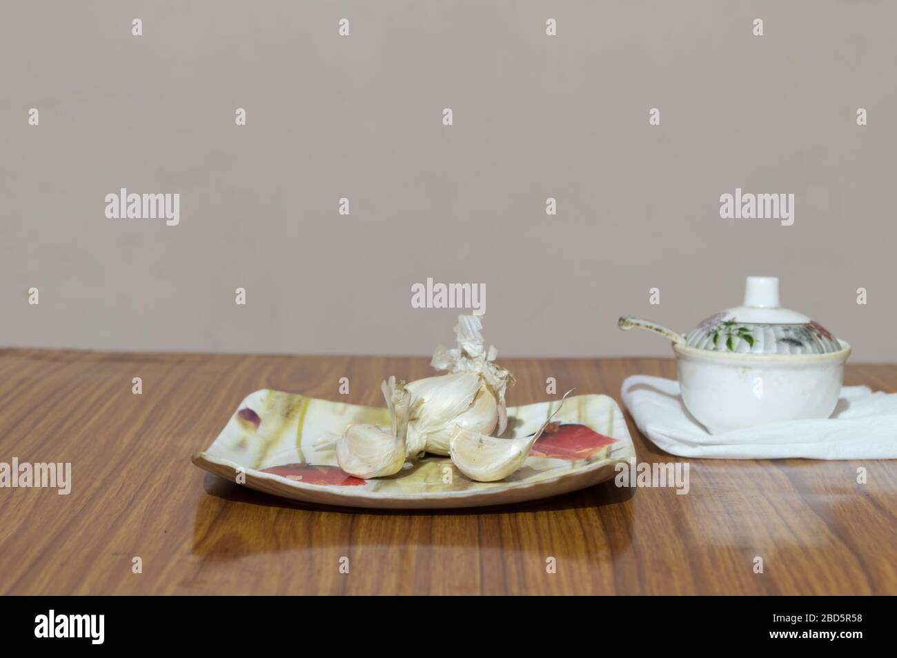 Garlic Salt on wooden table. Garlic salt is a seasoned salt made of a