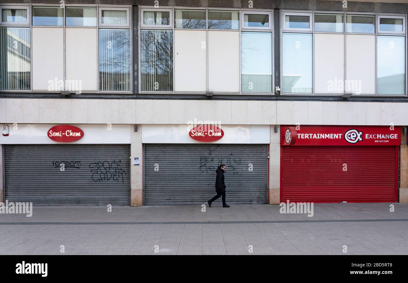 Leith, Edinburgh, Scotland, UK. 7 April 2020. In the third week of the nationwide coronavirus lockdown life in Leith continues although the streets are mostly deserted and shops closed. Pictured; Empty shuttered shops in Newkirkgate shopping arcade. Iain Masterton/Alamy Live News. Stock Photo