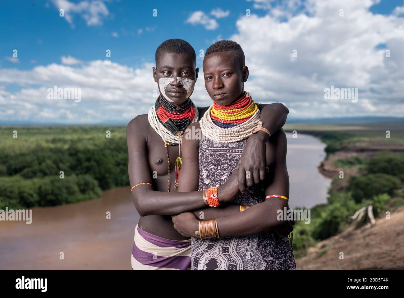 High above the Omo River, Karo tribe or ethnic group members are best friends, Tumi, Ethiopia. Stock Photo