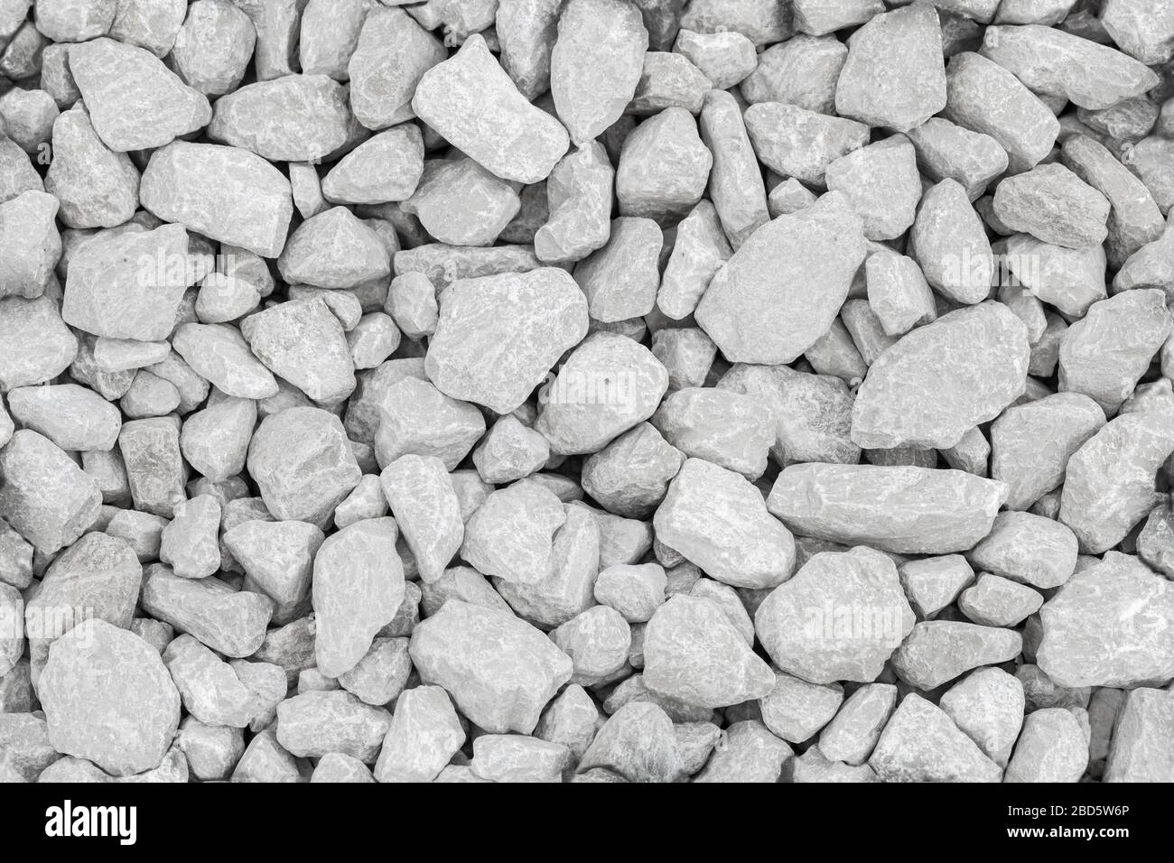 Dusty white industrial gravel on the ground, seamless background photo texture Stock Photo