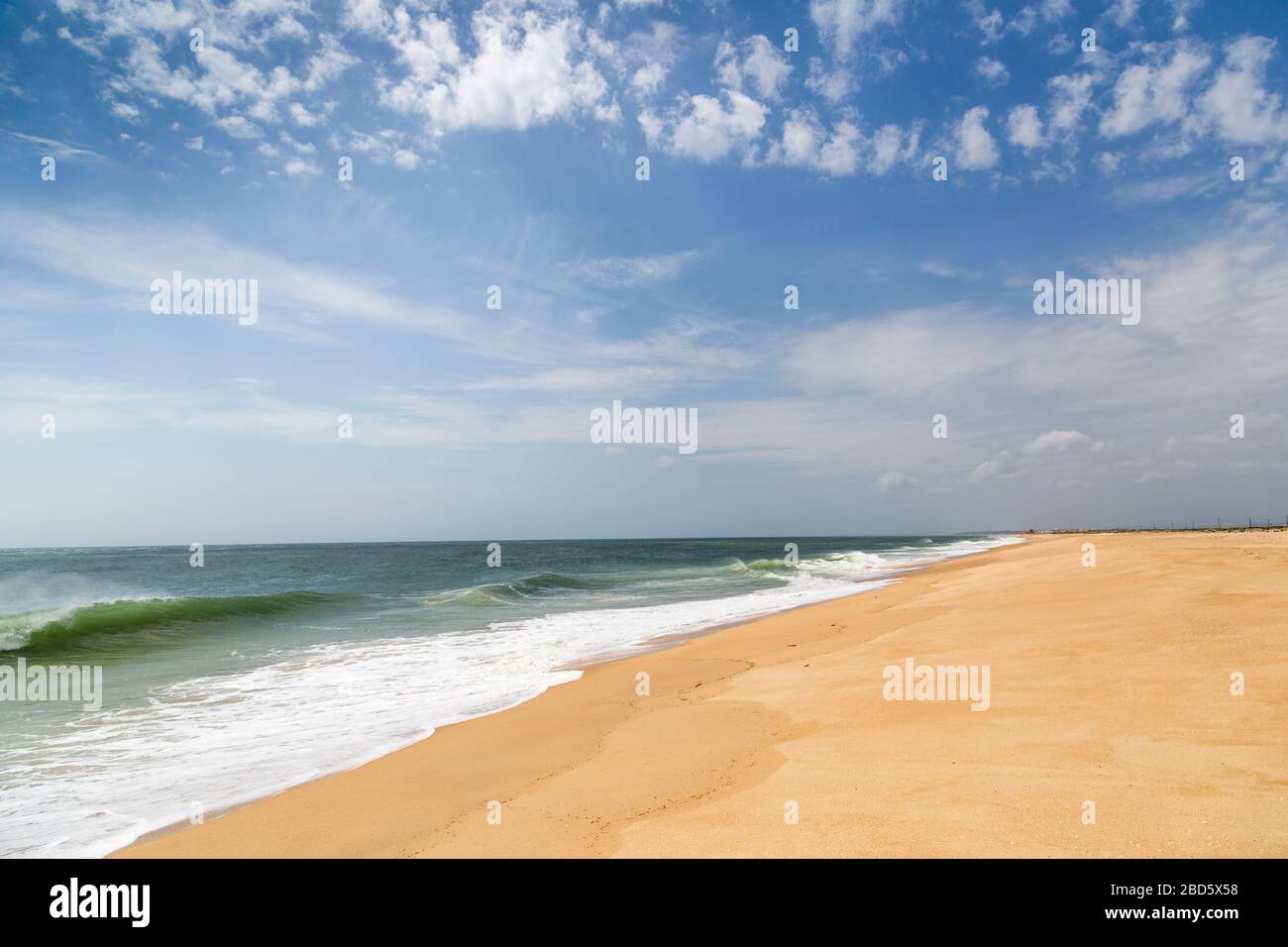 Empty beach, Praia de Faro (Mar), Algarve, Portugal Stock Photo