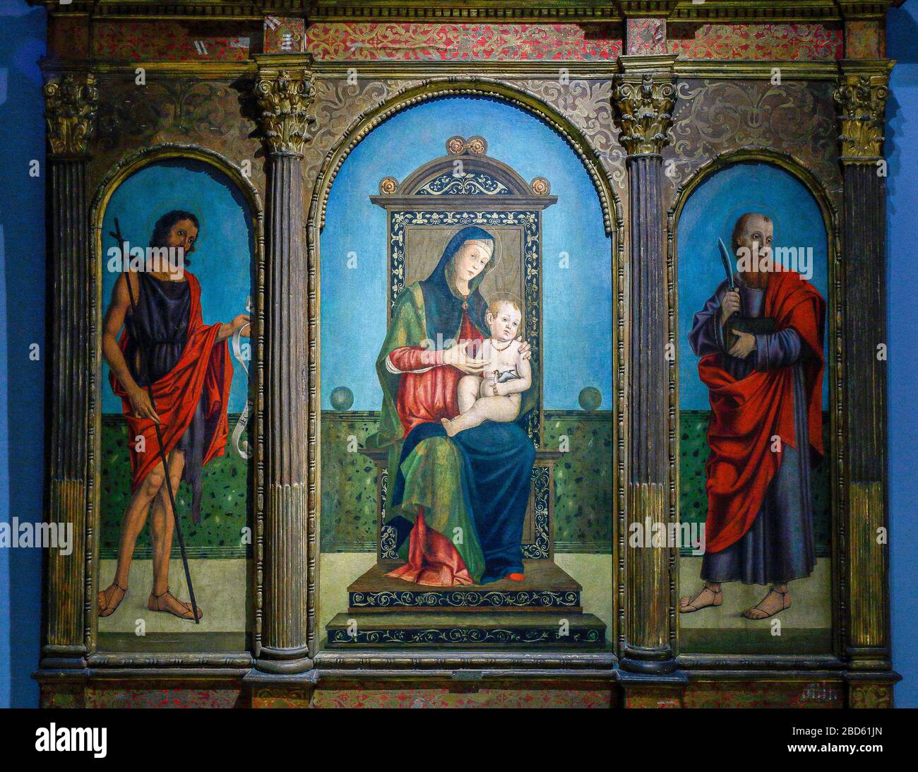 Italy Lombardy - Cremona - Civic Museum -' Ala Ponzone' - Filippo Mazzol -  triptych - Madonna and Child Enthroned, San Giovanni Battista and San Bartolomeo Stock Photo