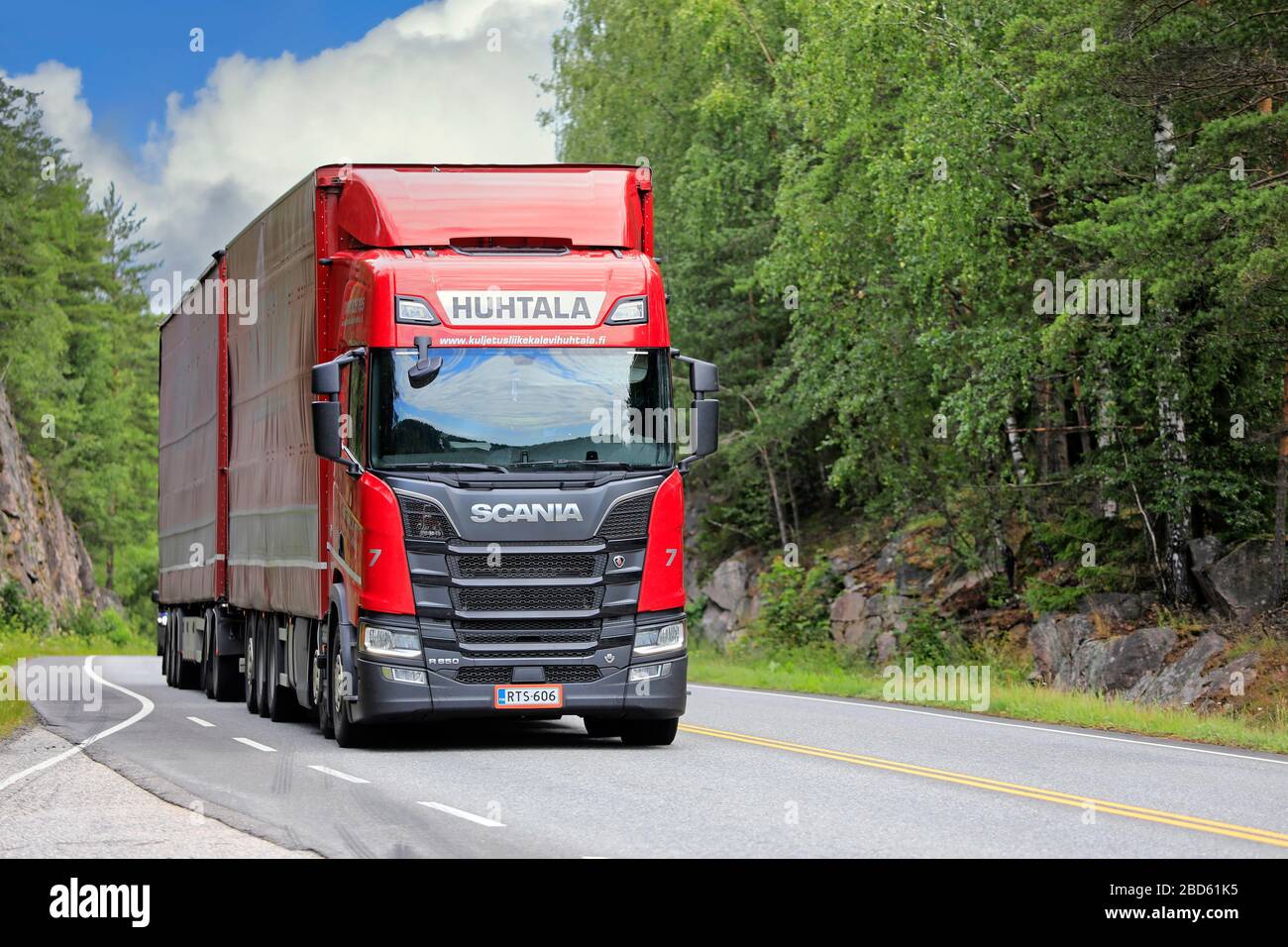Red Next Generation Scania R650 truck Huhtala pulls freight trailer on highway on a sunny day of summer. Salo, Finland. July 6, 2019. Stock Photo