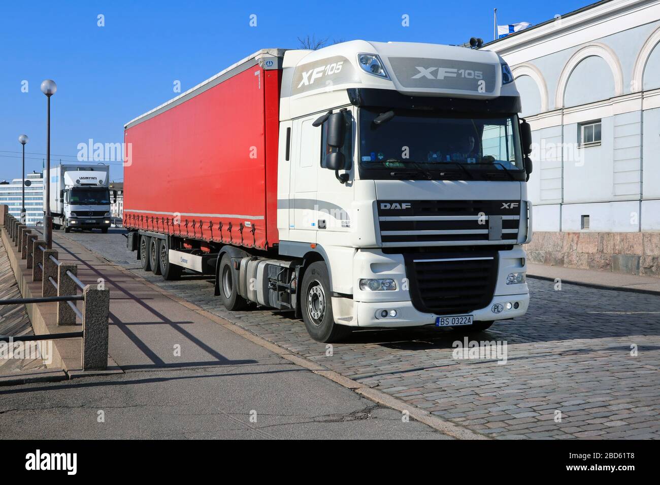 White DAF XF 105.460 semi trailer driving on cobbled Helsinki street after  arrival in Port of Helsinki, Finland on sunny day of spring. April 7, 2020  Stock Photo - Alamy