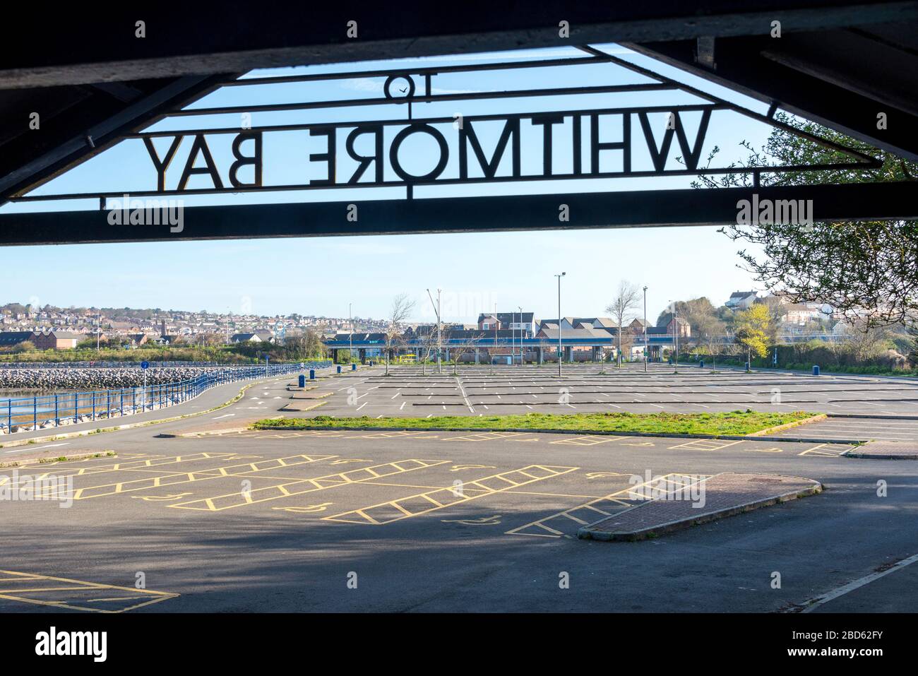 On a bright sunny morning a car park at Barry Island is deserted during the coronavirus Covid-19 crises. Stock Photo