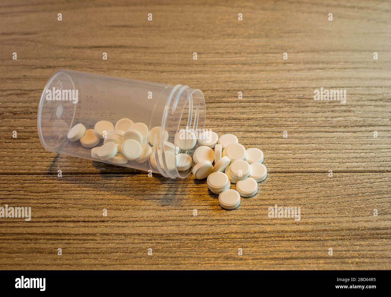 white pills on wooden background Stock Photo
