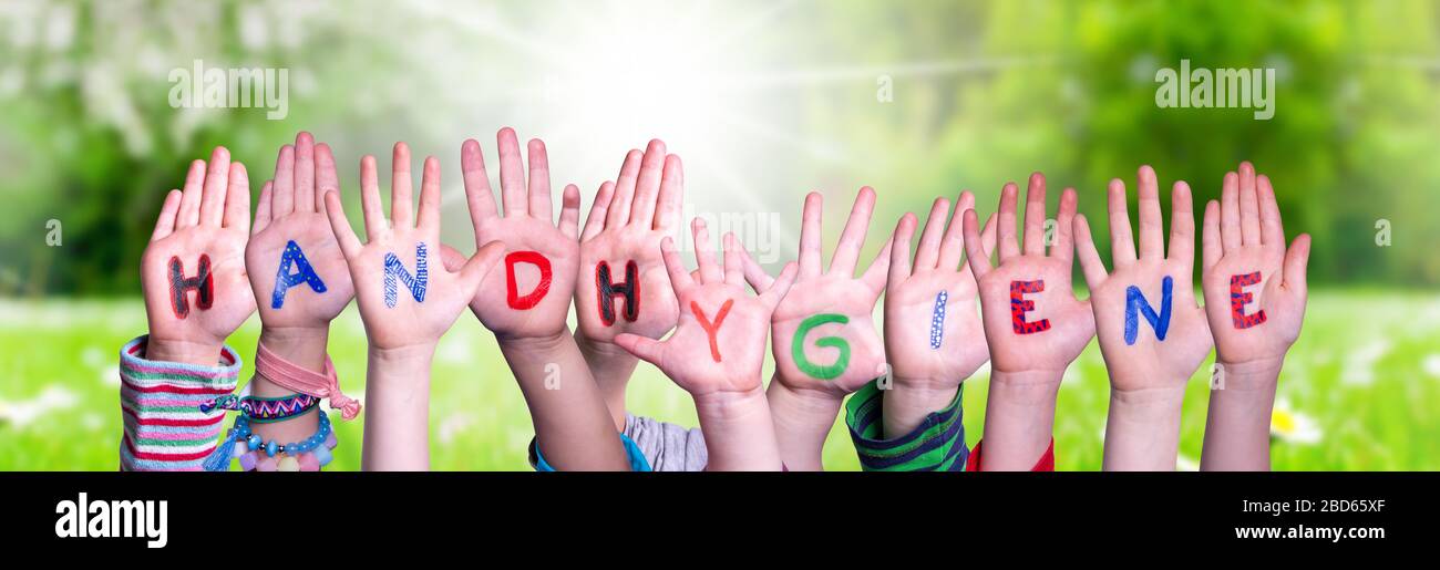Kids Hands Holding Word Handhygiene Means Hand Hygiene, Grass Meadow Stock Photo
