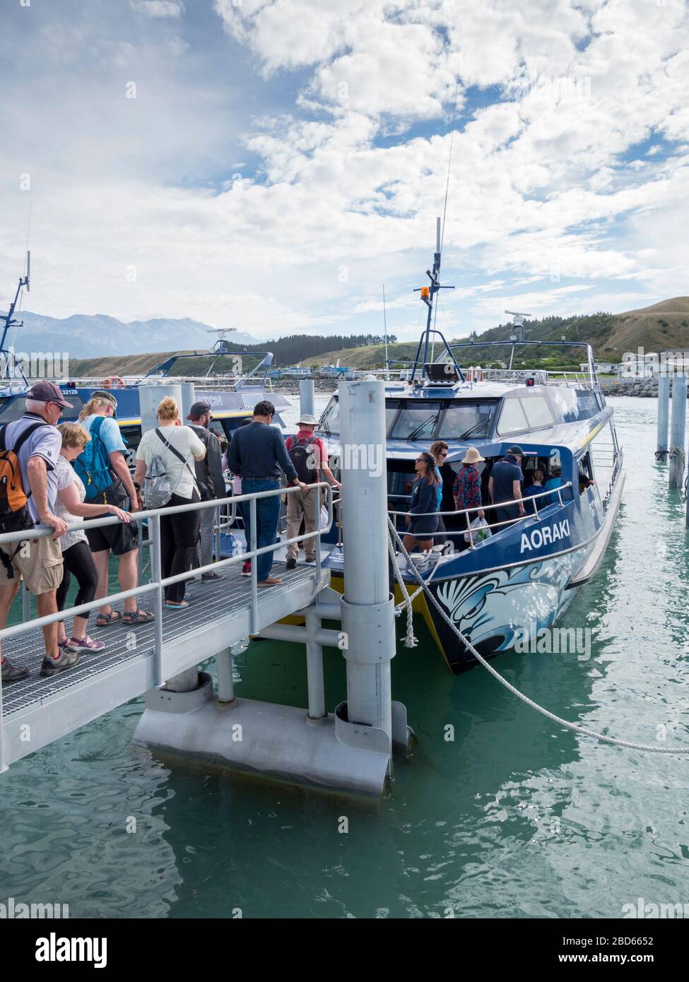 Tourists boarding the boat Aoraki on a whale watching trip in Kaikoura New Zealand Stock Photo