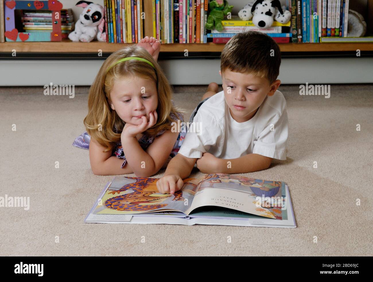 Boy and girl reading Stock Photo