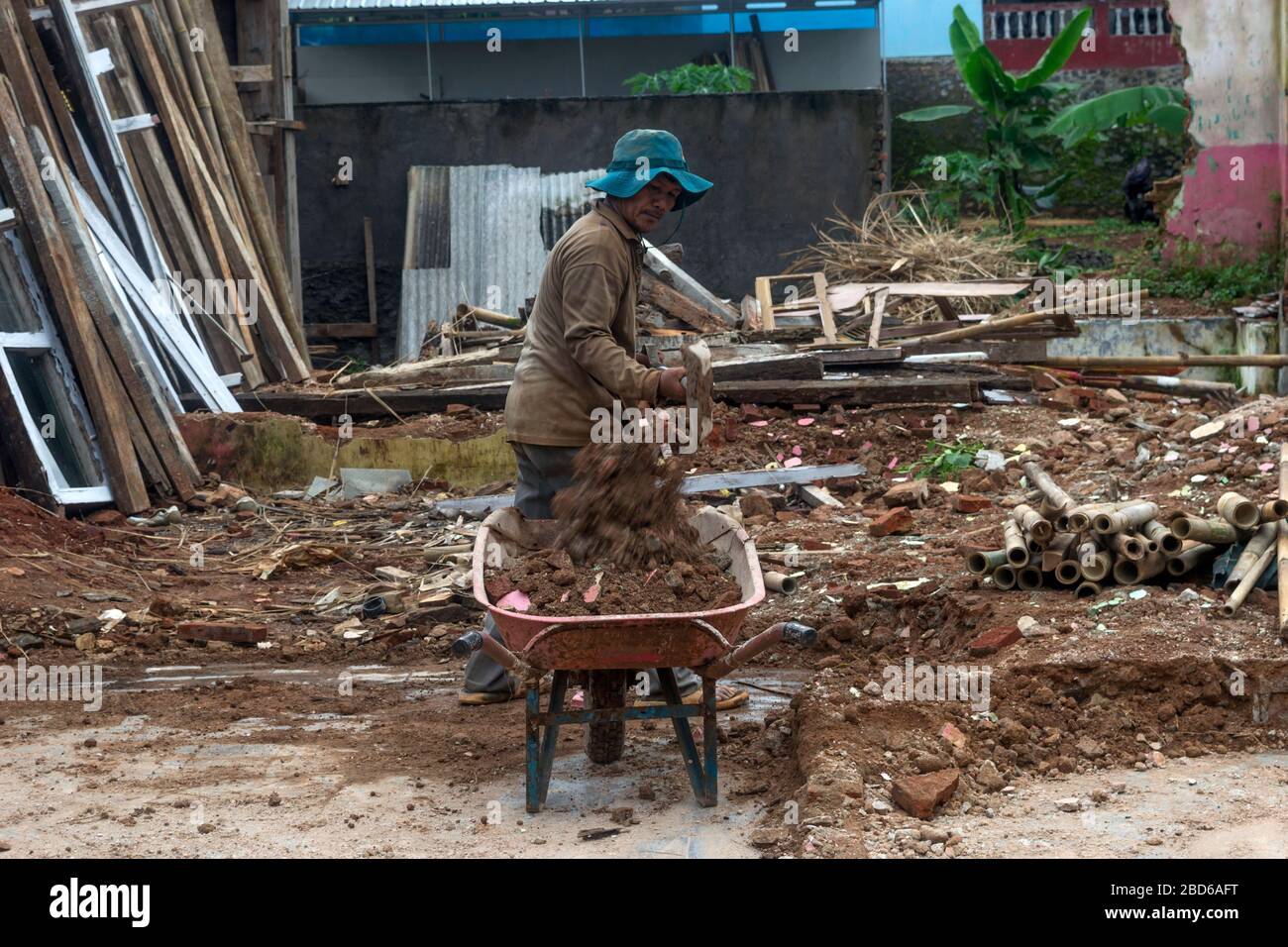 day laborers are cleaning up debris Stock Photo