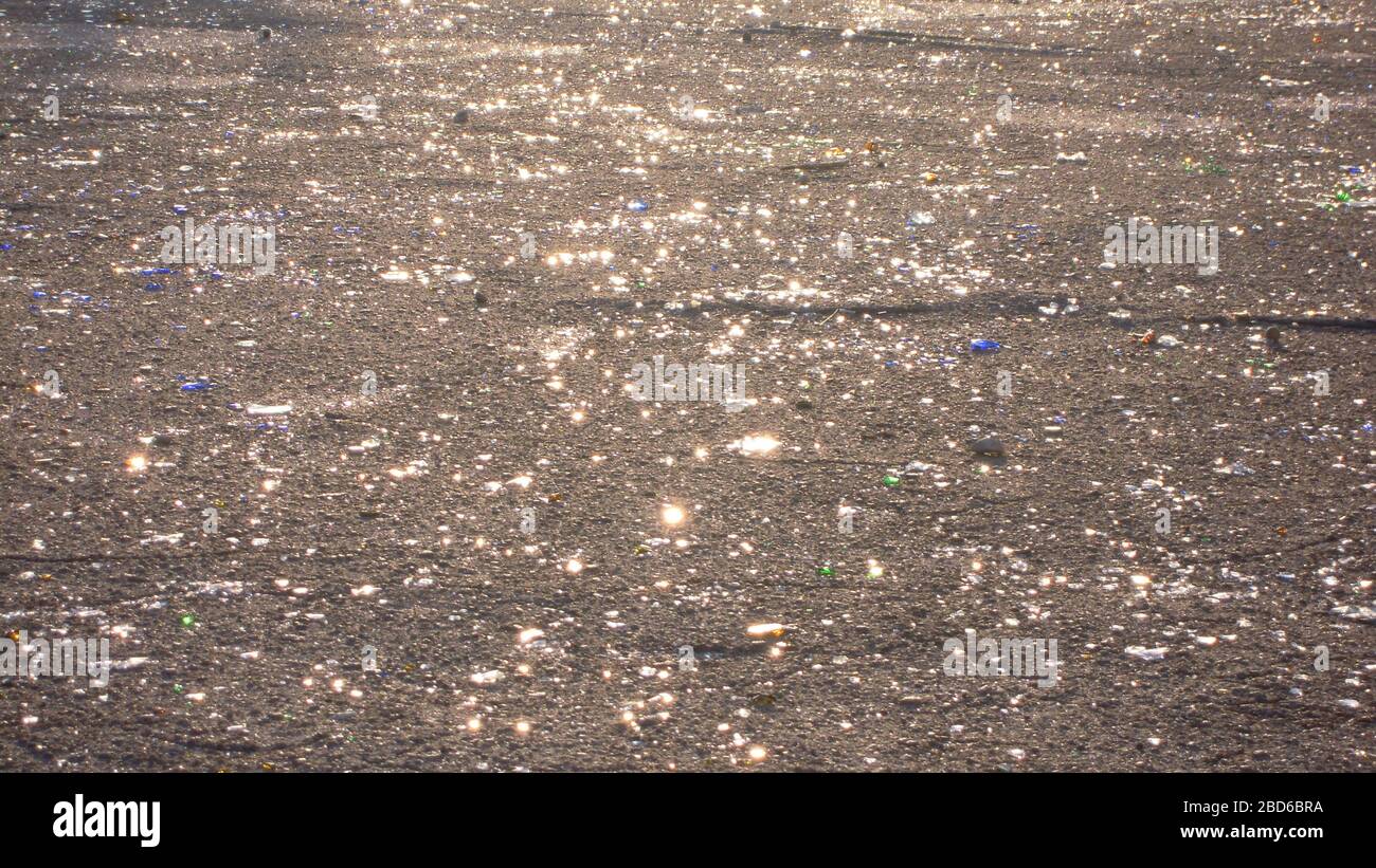 Beer Rings Polution Broken glass bottles of beer and alcohol on the sidewalk. Urban ...