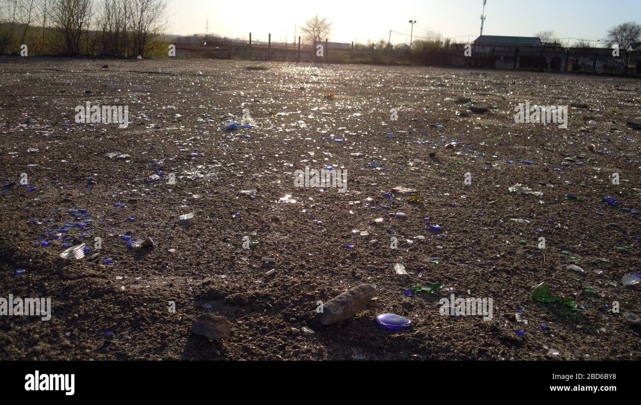Beer Rings Polution Broken glass bottles of beer and alcohol on the sidewalk. Urban ...