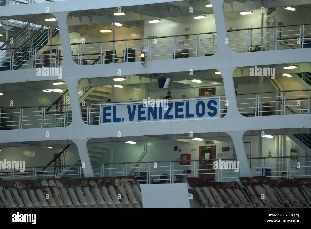 Person wearing a mask (centre) in  El. Venizelos ship, which is in quarantine due to covid-19 in Piraeus port. (Photo by Dimitrios Karvountzis/Pacific Press) Stock Photo