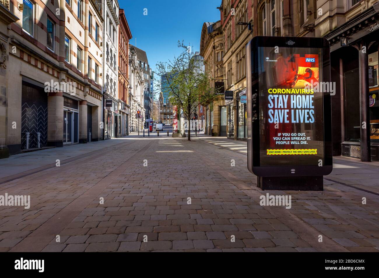 'Stay Home Save Lives' signs, Coronavirus Outbreak, King Street, Manchester City Centre, United Kingdom, April 2020. Stock Photo