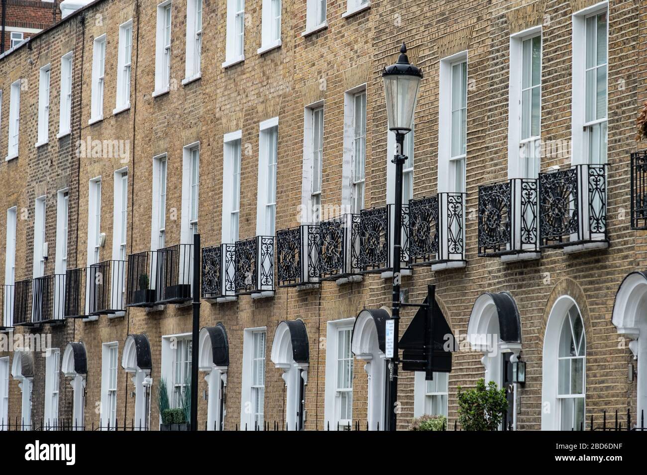 Attractive row of grand townhouses in Kensington, London Stock Photo