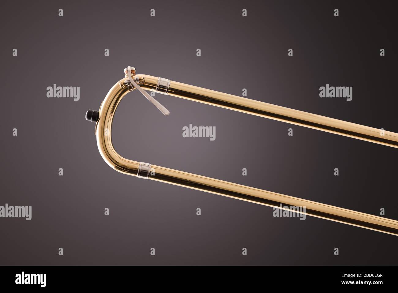 Slide part of a trombone and water key detail with gray gradient