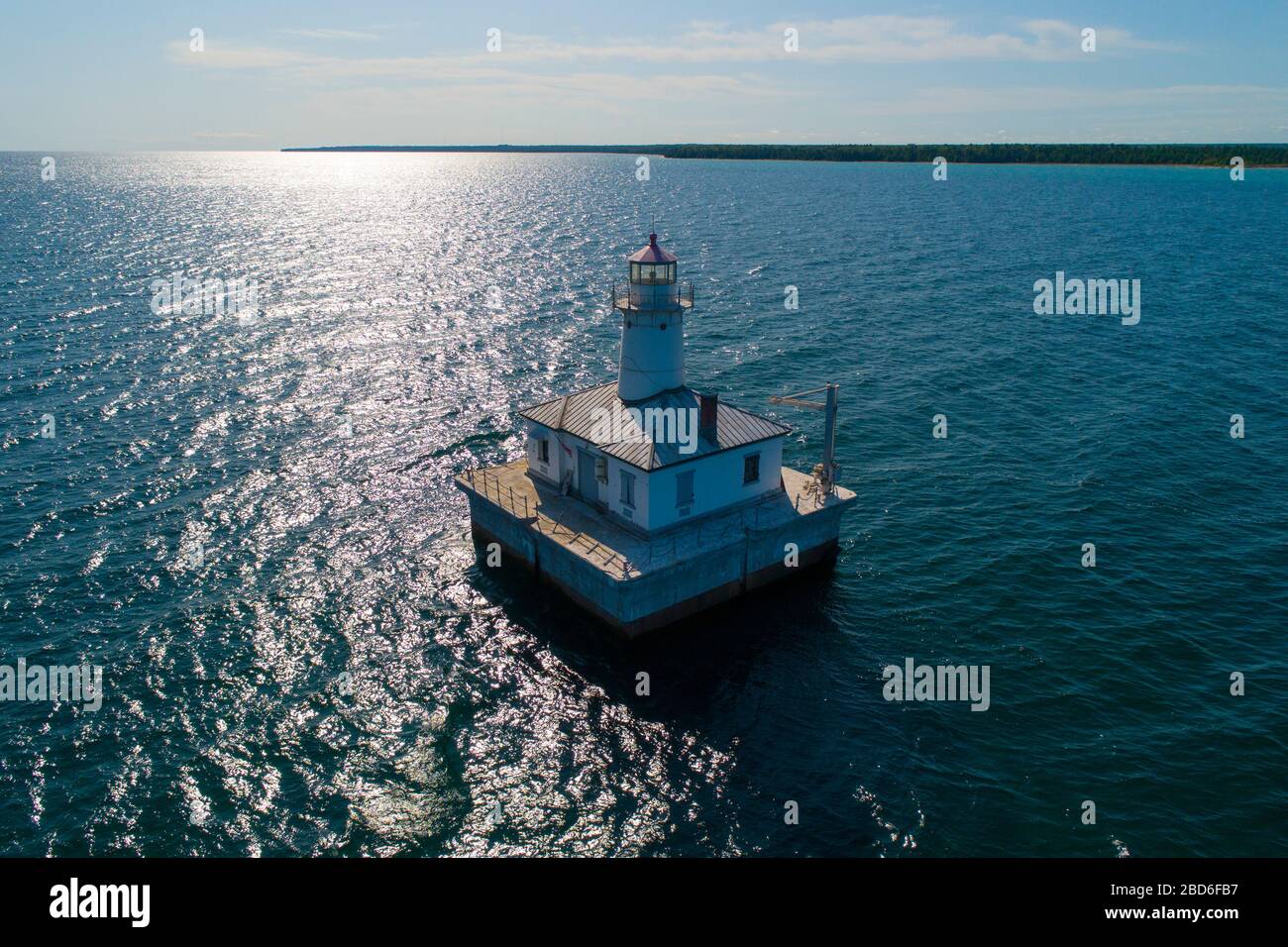 14 foot shoal in Cheboygan Michigan lighthouse tower with a powerful light that is built on or near the shore to guide ships away from danger Stock Photo