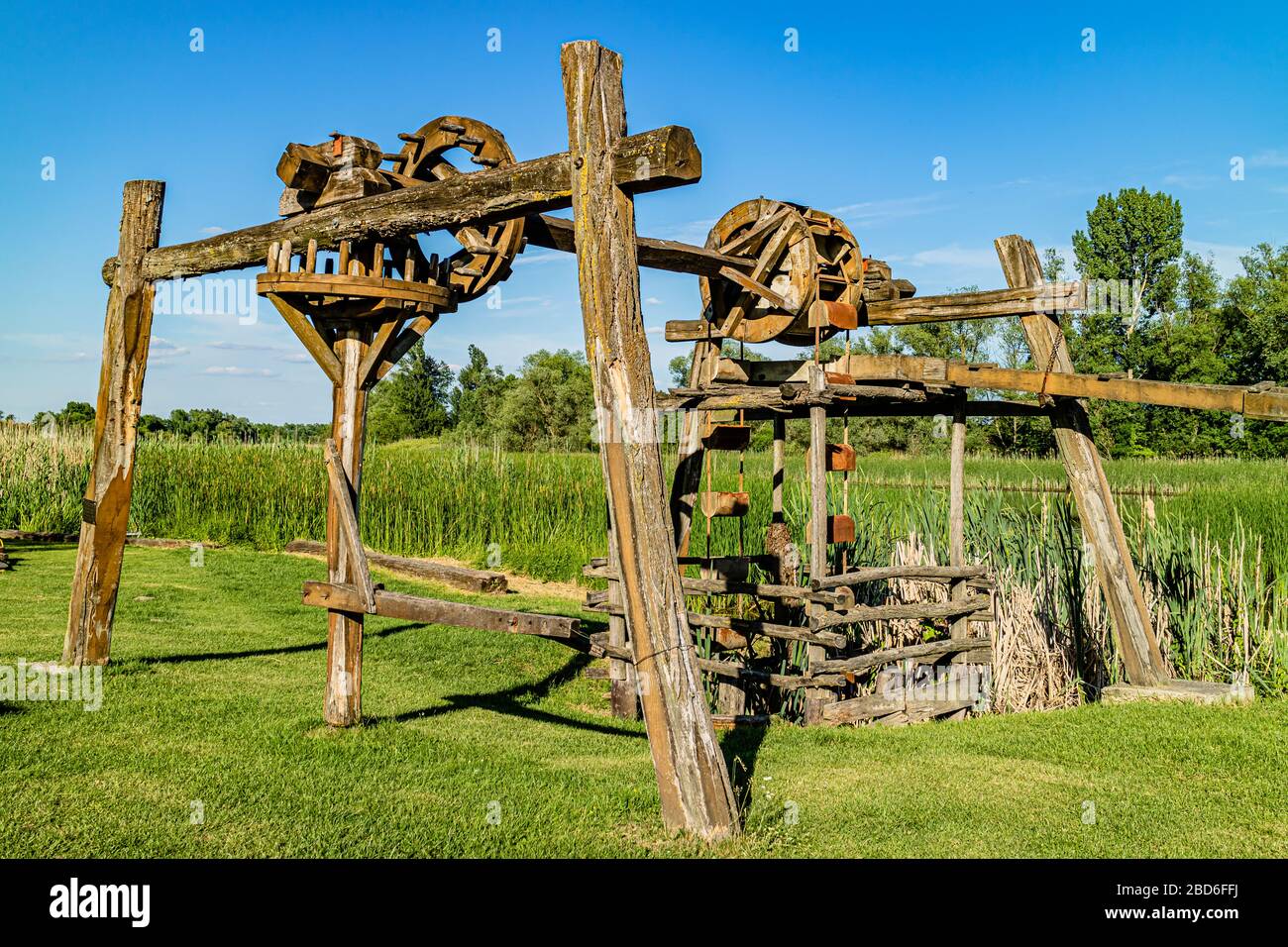 A traditional wooden water well at the visitor centre for Zasavica national nature park, Zasavica, Serbia. May 2017. Stock Photo
