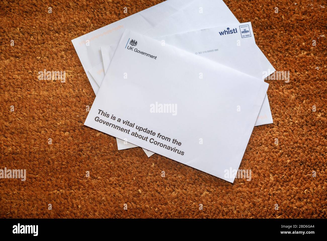 Coronavirus pandemic: a letter with a booklet of advice and instructions arrives on the doormat from the UK Government, posted to every home Stock Photo