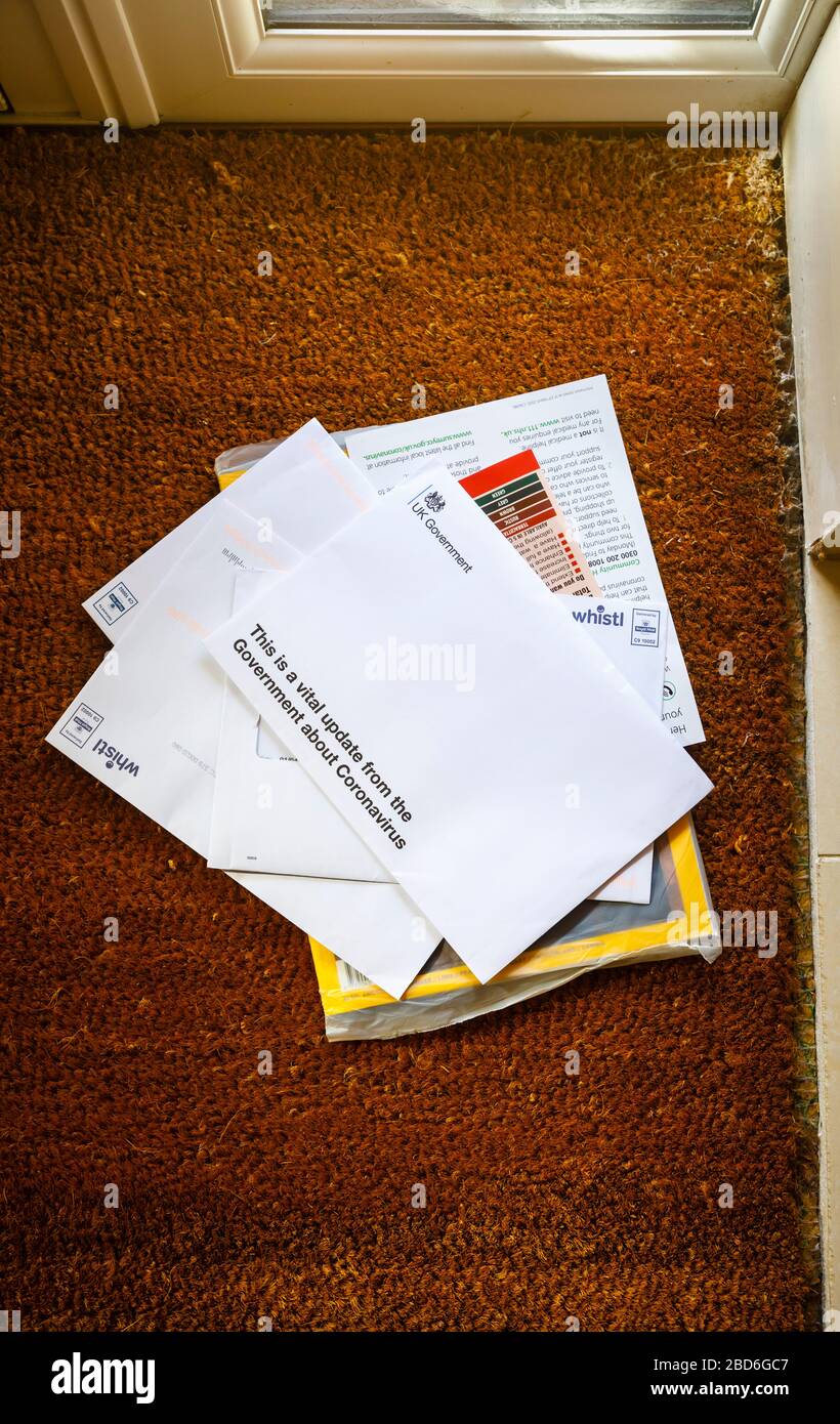 Coronavirus pandemic: a letter with advice and instructions from the UK Government arrive on the doormat, delivered by post to every home Stock Photo