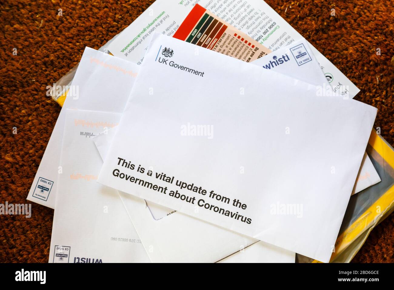 Coronavirus pandemic: a letter of advice and instructions from the UK Government arrive on the doormat, delivered by post to every home Stock Photo