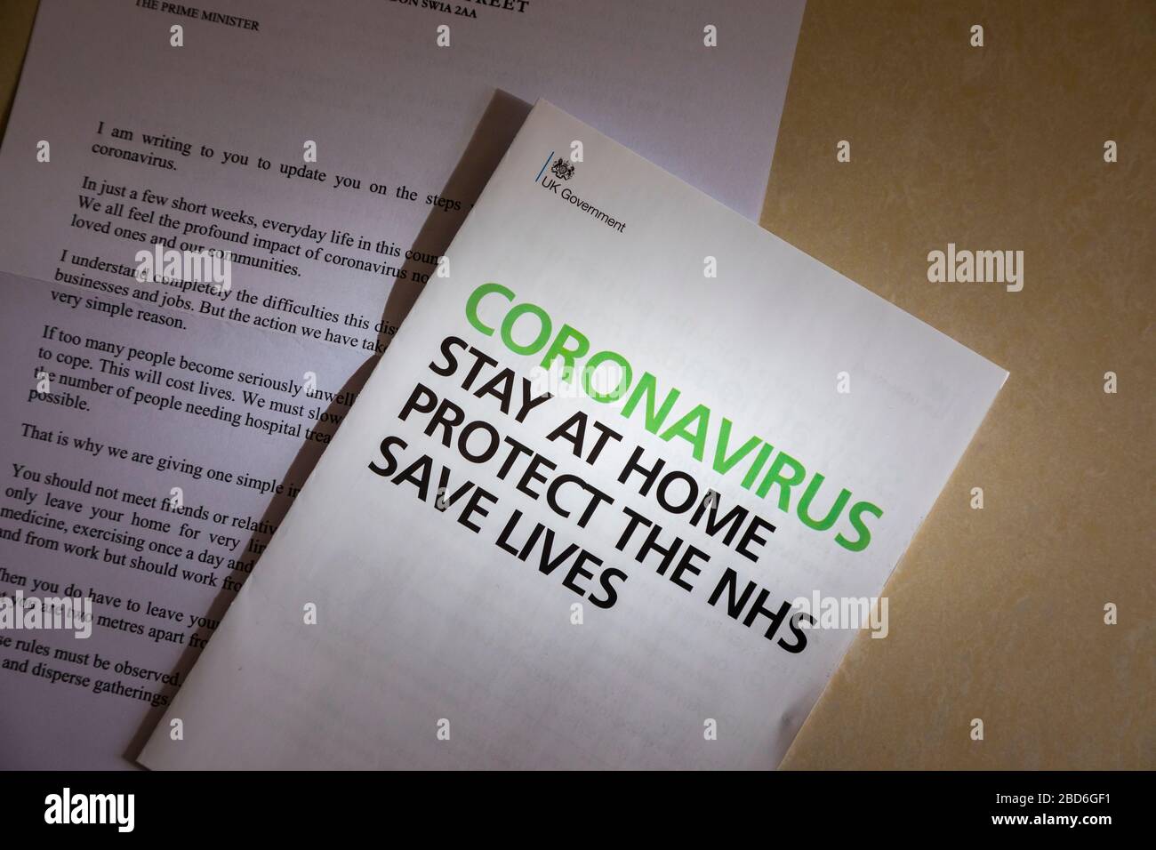 Coronavirus message from the UK Government in a letter and booklet posted to every home: stay at home, protect the NHS, save lives Stock Photo