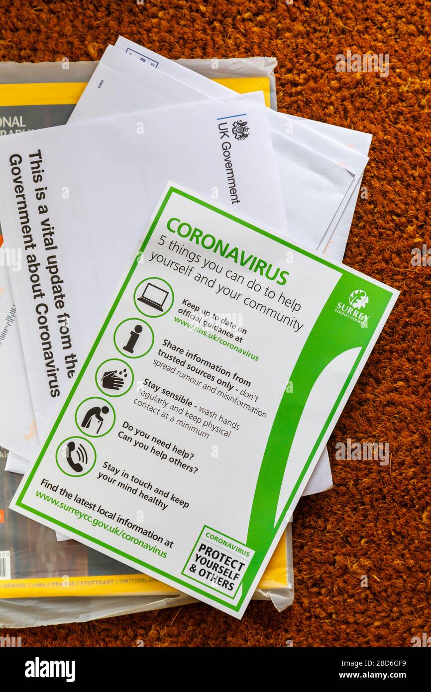 Coronavirus pandemic: advice and instructions from the UK Government and Surrey County Council arrive and are delivered by post to every home Stock Photo