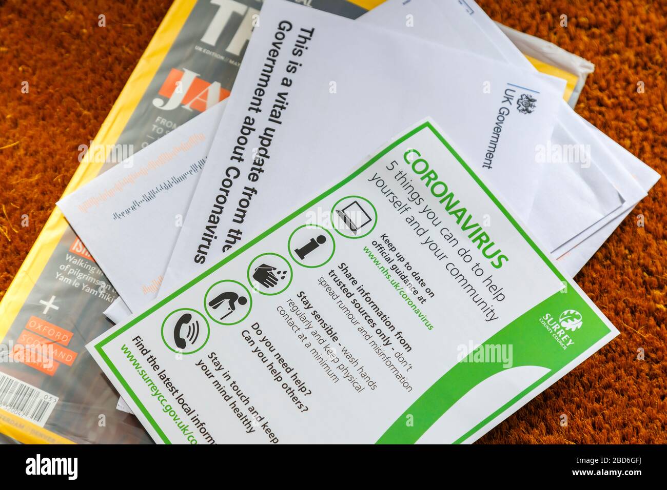 Coronavirus pandemic: advice and instructions from the UK Government and Surrey County Council arrive and are delivered by post to every home Stock Photo