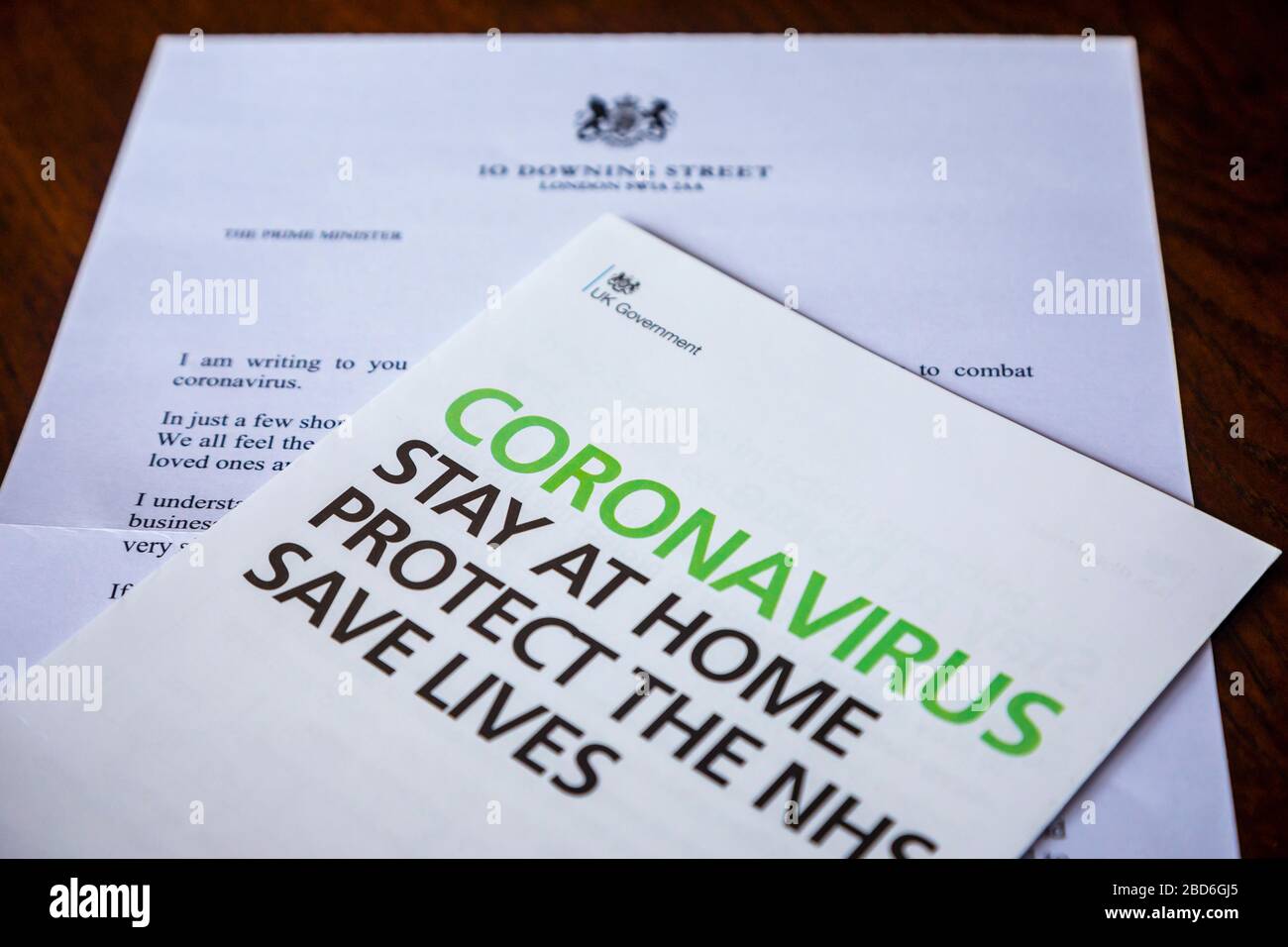 Coronavirus message from the UK Government in a letter and booklet posted to every home: stay at home, protect the NHS, save lives Stock Photo