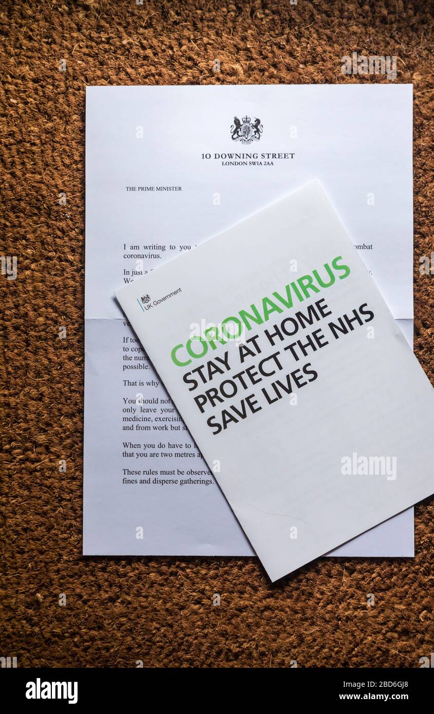 Coronavirus message from the UK Government in a letter and booklet posted to every home: stay at home, protect the NHS, save lives Stock Photo